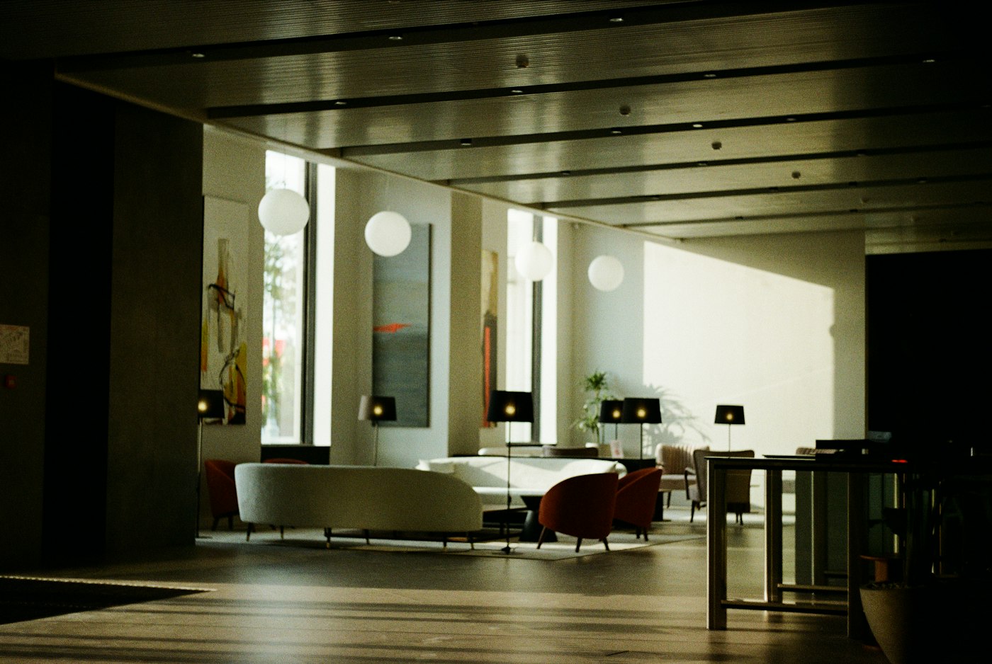 Modern social lounge seating area with ambient lighting, generic illustrative photo