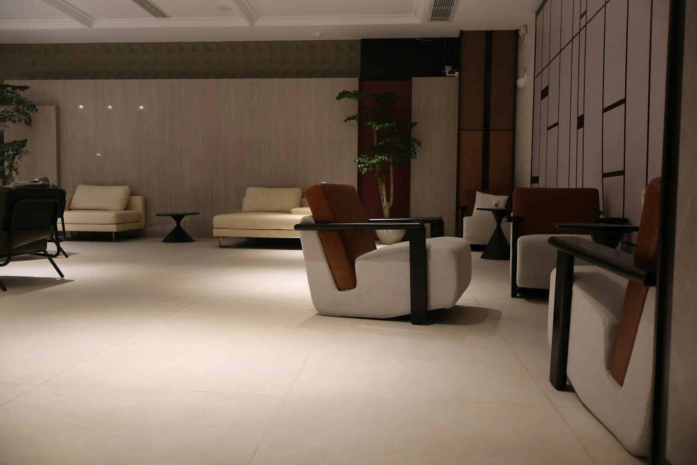 Modern visitor waiting lounge with sofa seating, generic illustrative photo