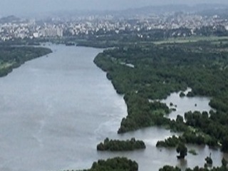 Aerial photo of a river creek bend with mangroves, near Mumbra