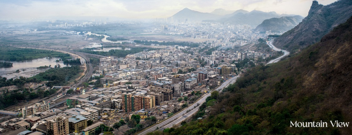 Aerial photo of Mumbra town and hills, captioned Mountain View